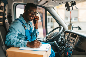Young Afro-American or African male working in everyday or daily home delivery service.