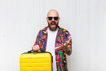 bald man looking angry, annoyed and frustrated screaming wtf or what’s wrong with you