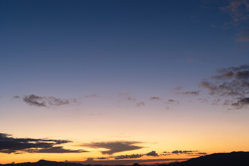 Sunset background with wonderful golden yellow sky,