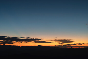 Sunset background with wonderful golden yellow sky,