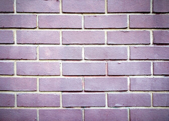 abstract geometric background paved with purple brick, selective focus