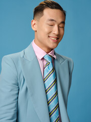 Handsome young man in suit smiling Asian appearance portrait