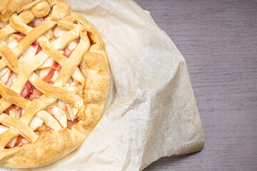 dessert baking concept. apple pie above view on a paper background. studio shot. homemade cooking concept
