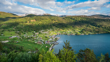 Naklejka na ściany i meble Beautiful nature landscape with a small village by the sea in Norway