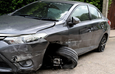 Closeup of damaged black car from road accident. 