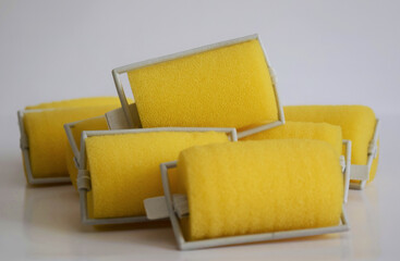 Yellow hair rollers, hair curlers, beauty theme 