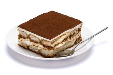 Traditional Italian Tiramisu square dessert portion on ceramic plate isolated on white background with clipping path