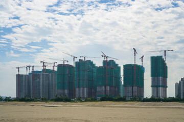 Mass of large precast building and tall Tower crane in construction work