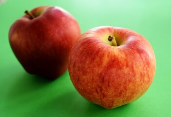 red apples on a green background
