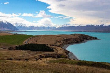 peninsula extends into lake tekapo with moutains
