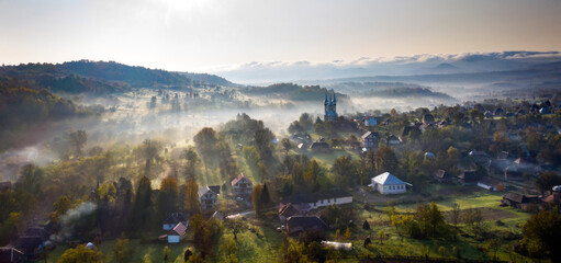 Obraz premium Aerial view over small rural village of Breb in magic sunrise.