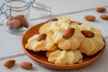 Almond cookies on wooden plate