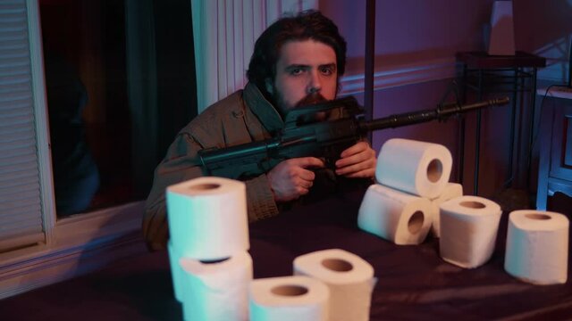 crazy guy gaurding toilet paper with gun