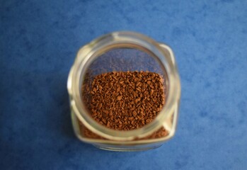 coffee in the jar on the blue background