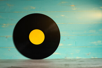 Vinyl record on wooden background,Old vintage vinyl record isolated