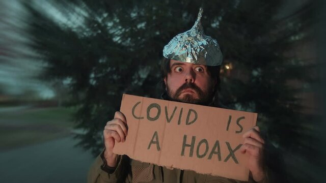 covid is a hoax guy with tin foil hat