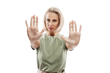 Young blonde woman shows hands with palms forward. Stop, no, protest. Isolated on white background....