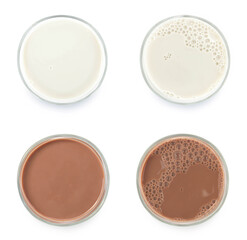 Milk and Chocolate milk puddle in glass isolated on white background. top view.