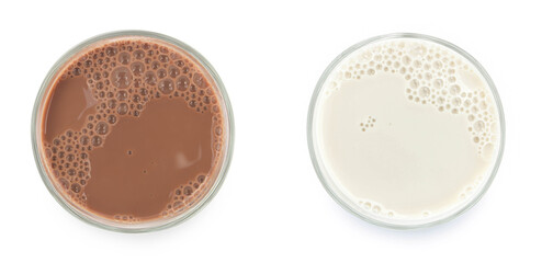 Milk and Chocolate milk puddle in glass isolated on white background. top view.