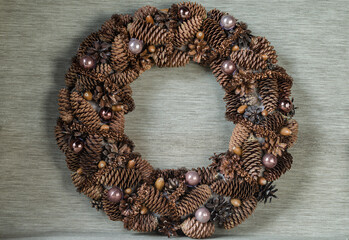 Christmas wreath in natural style on a gray background close-up