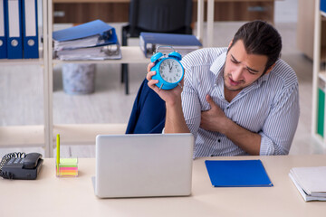 Hungry male employee waiting for food in time management concept