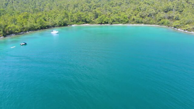 Aerial nature landscape of secret bay of Aegean Sea where green and blue meets. Pure nature with incredible clear green waters on a summer day in Didim, Turkey