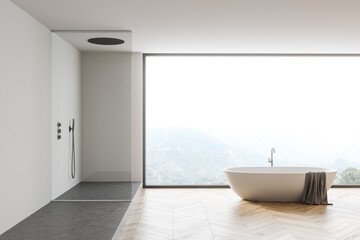 White bathroom interior with tub and shower