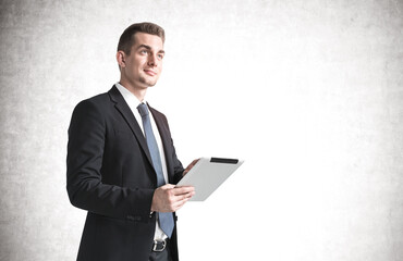 Young businessman with tablet, mock up