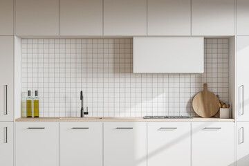 White kitchen interior with cupboards, close up