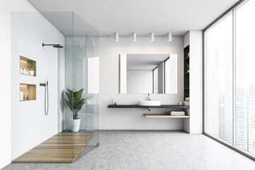 White bathroom with shower cabin and sink with mirror near big window