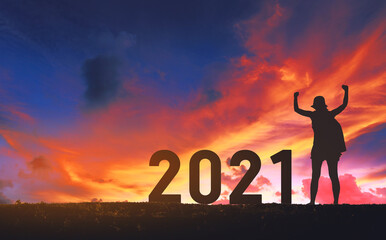 New year 2021 traveler woman with sunset sky background