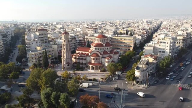 Aerial view of Greek Orthodox Church in the city of Thessaloniki, Greece, backward movement by drone