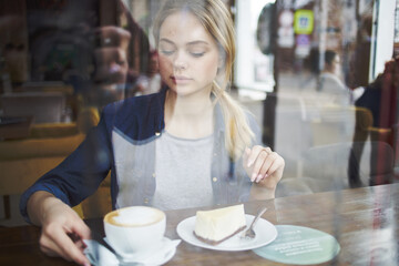 Cheerful woman cup of coffee cake lifestyle leisure