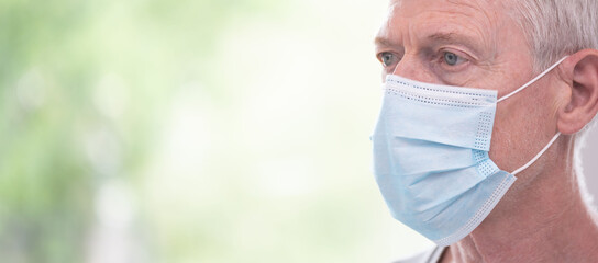 Senior man wearing a medical face mask