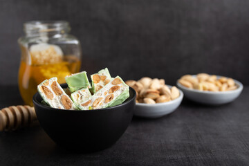Homemade pistachio nougat on a dark rustic background