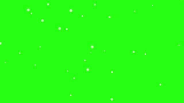 White snow falling in winter of Christmas day on green screen background.