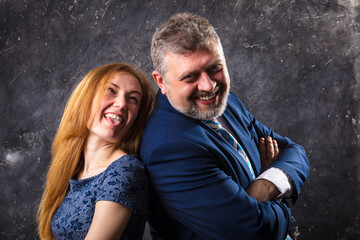 Fototapeta premium Bearded man and young woman, happy couple studio portrait