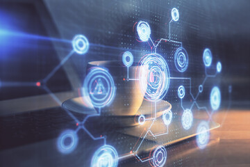 Double exposure of desktop computer and technology theme hologram. Concept of software development.