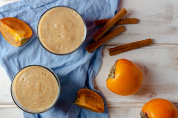 Persimmon smoothie with orange, milk and banana