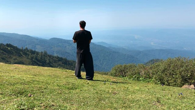 Mountain View Meditation. Man Doing Meditation Practice Alone in a Peaceful Place.