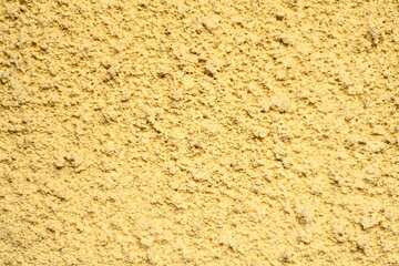 Betonowa ściana pomalowana na żółto - obrazy, fototapety, plakaty