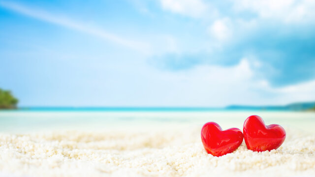 red Heart shape on white sand beach ,Image for love valentine day or summer vacation concept
