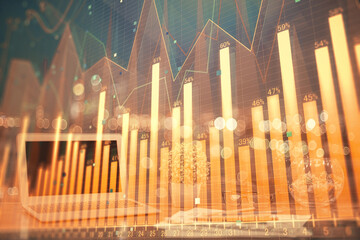 Financial chart drawing and table with computer on background. Double exposure. Concept of...
