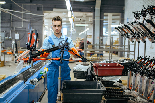 Bicycle Factory, Worker Holds Teen Bike Frame