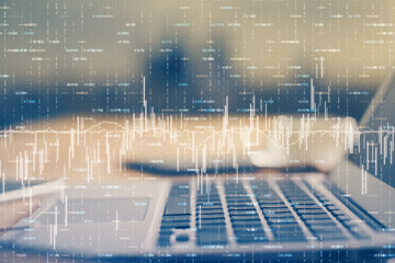 Double exposure of chart and financial info and work space with computer background. Concept of international online trading.