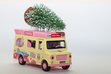 colorful toy food truck with christmas tree