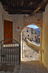 A narrow street among the old houses of Castellabate, a medieval village in the Campania region, Italy.
