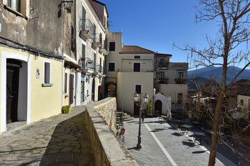 Fototapeta premium A narrow street among the old houses of Castellabate, a medieval village in the Campania region, Italy. 