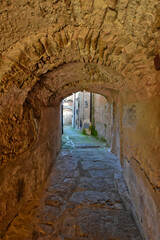 A narrow street among the old houses of Castellabate, a medieval village in the Campania region, Italy.
