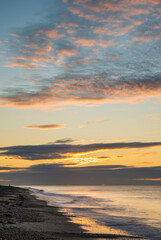Stunning colorful sunrise over beach landscape on English South coast